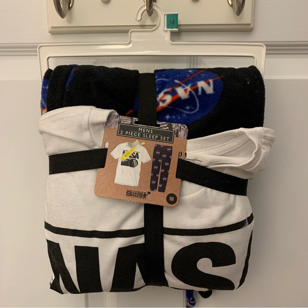NWT NASA pajama set: white tshirt and black patterned fleece pants. Unisex M.